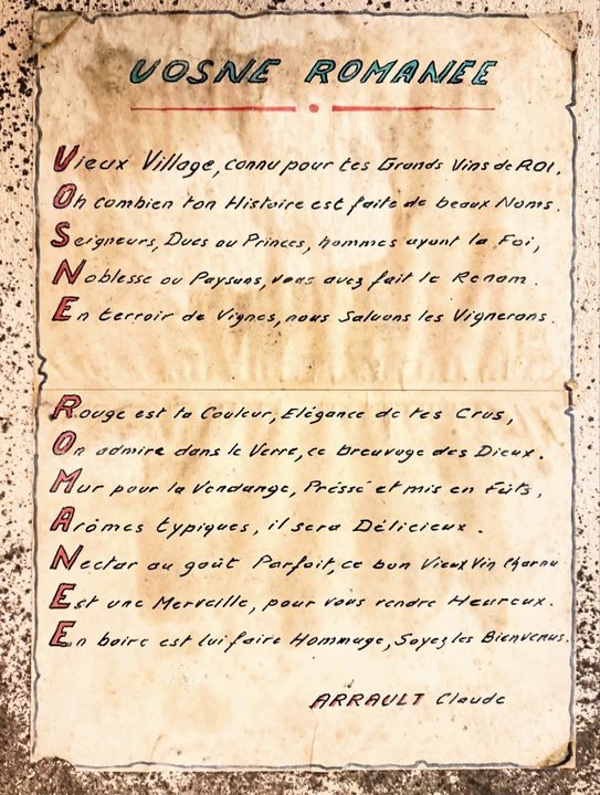 A hand-lettered acrostic poem to Vosne-Romanée pinned to a wall