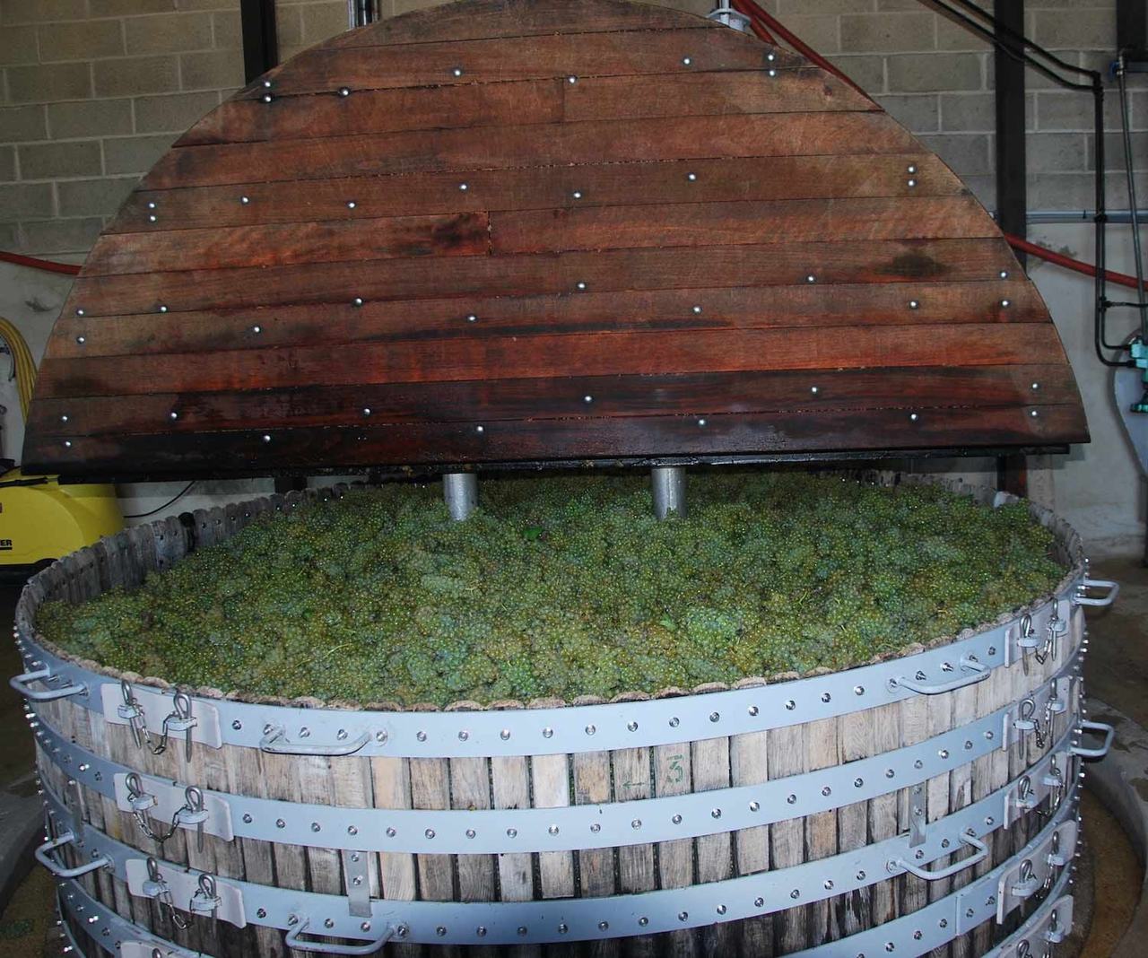 The four-thousand-kilo Coquard wooden press loaded with Chardonnay