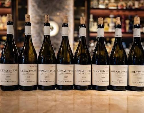 Eight bottles of Domaine Nicolas Rossignol in a row: Volnay Chevret and Santenots, Pommard Clos de Verger and Chaponnières, 2017 and 2018