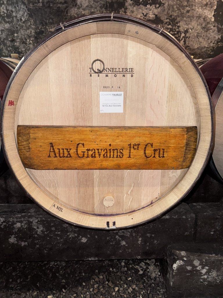 The head of a new Tonnellerie Rémond barrel branded Aux Gravains 1er Cru, with a Domaine Pavelot label, 2025